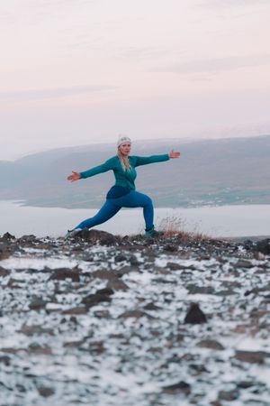 Woman posing on hill in snow