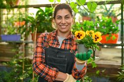 Happy woman with flower in hand