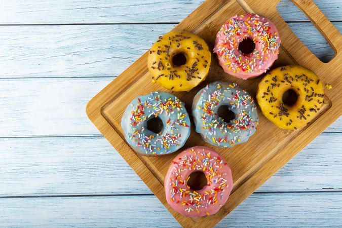 Delicious assorted colorful donuts on the table.