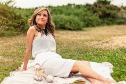 woman looking the sky and sitting outdoors