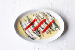 Delicious small sea fish on dish