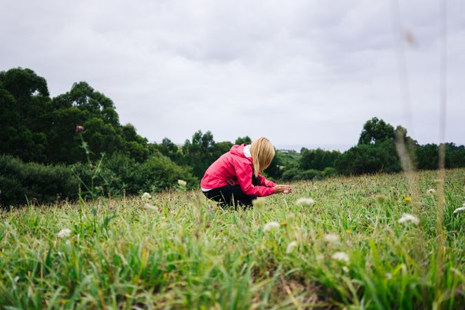 Cheerful woman enjoying countryside landscape