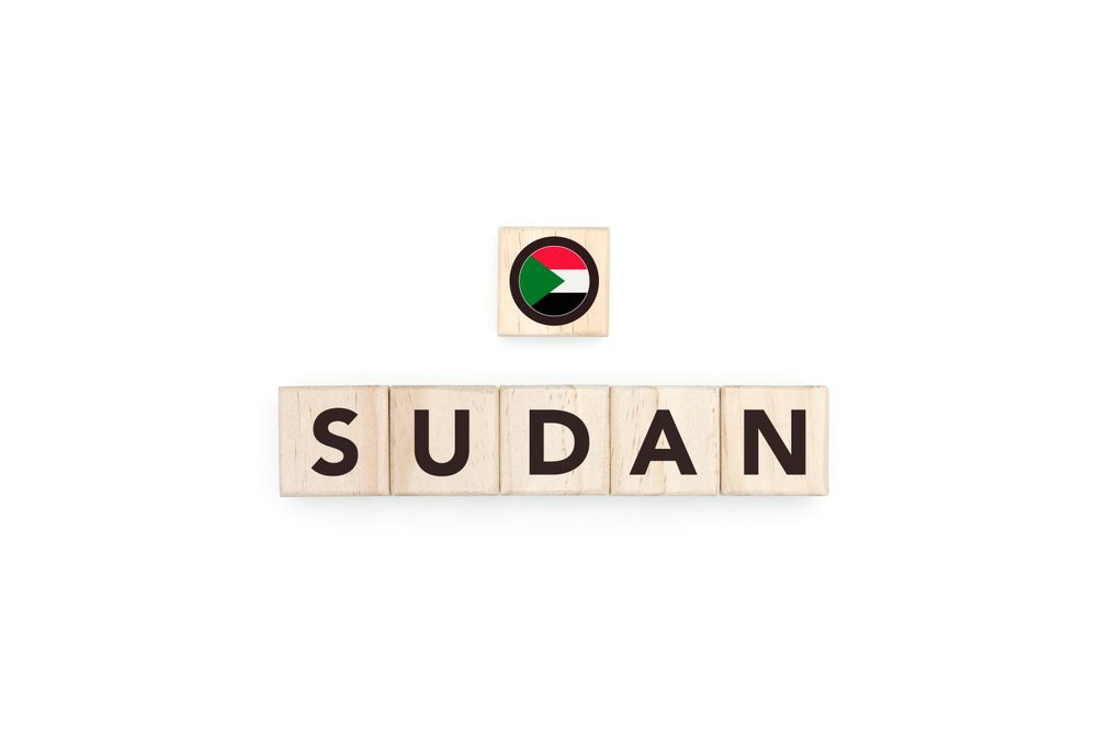 Wooden blocks bearing the name and flag of Sudan.
