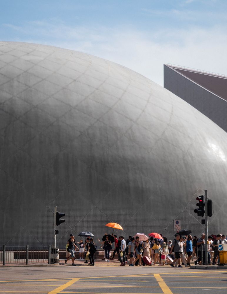 Crowd of people walking at the exterior of Hong Kong Space Museum