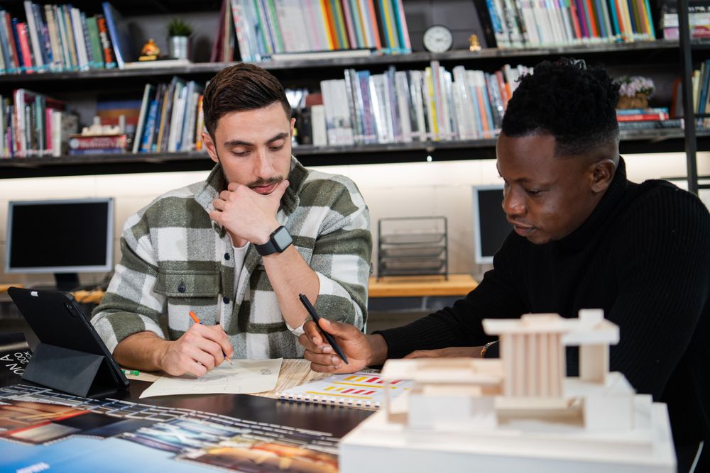 Two male colleagues working on design project