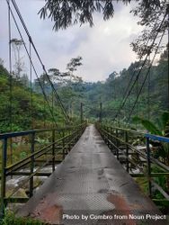 An Old Bridge Spanning A River Connects Two Village In A Mountain ...