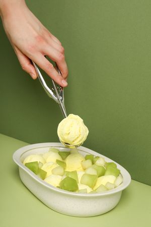 Ice cream with fresh melon in a bowl