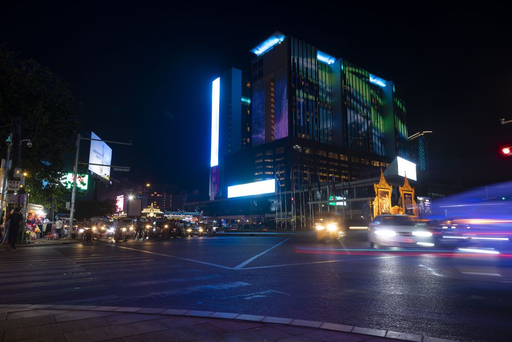 Lights and traffic of motorcycles and cars at night, on Preah Suramarit Blvd, Cambodia capital