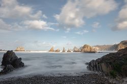 Wonderful ocean rocky coast in fair weather