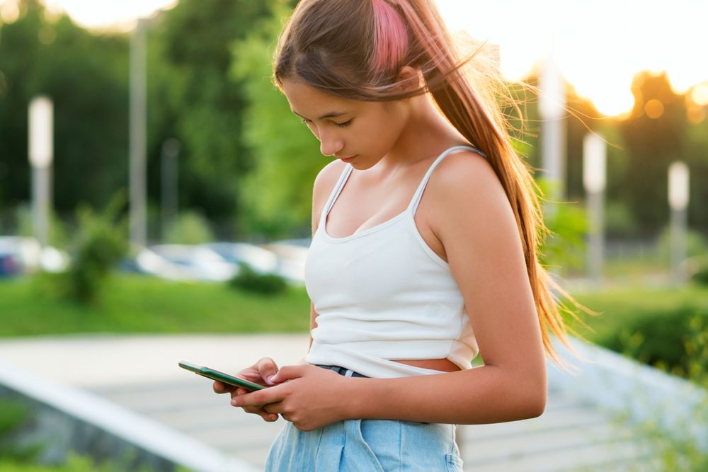 Teen girl using smartphone