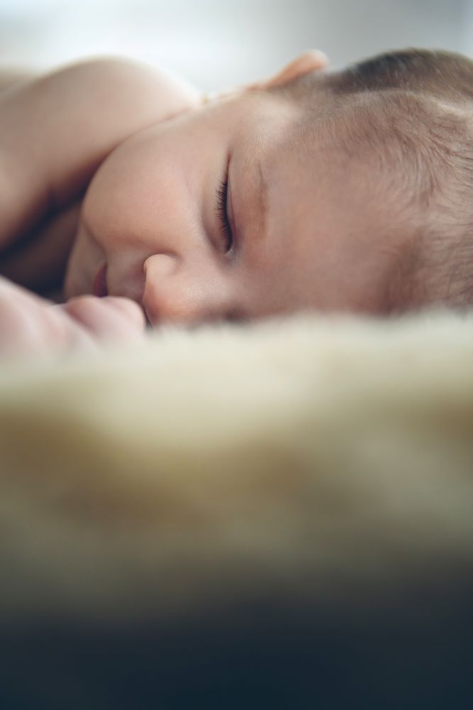 Baby sleeping on a blanket