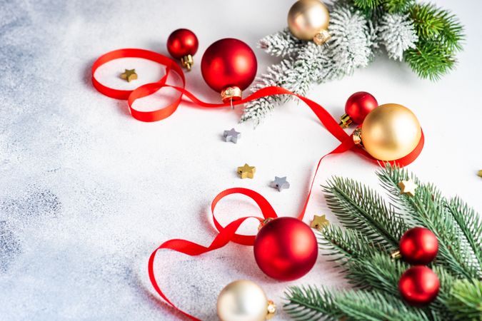 Fir on counter with ribbon, and red & gold baubles