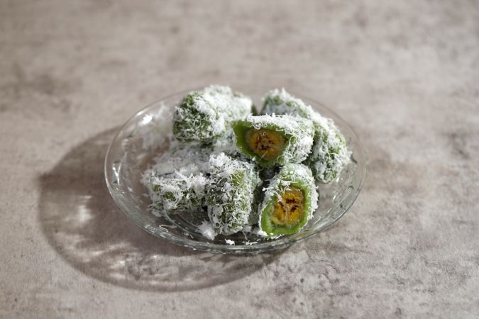 Sanggar Banyu or Putri Noong, Bananas Wrapped in Rice Flour Dough, Steamed, Covered with Grated Coconut
