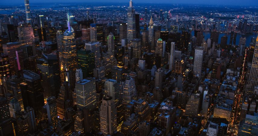 Big City Lights Panoramic Cityscape in the Evening. Aerial View of New York City at Night. Helicopter Tour for Tourists, Showing Famous Manhattan Cinema Sights, Business Districts and Architecture