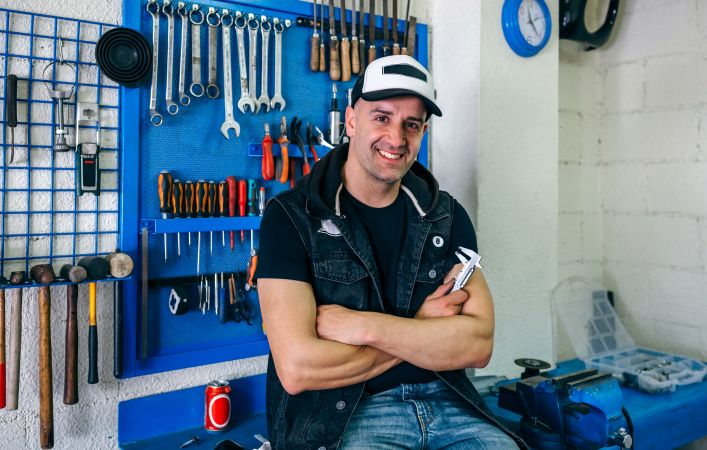 Mechanic posing with a motorcycle