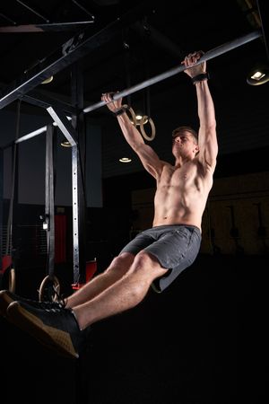 Athletic man training on bar
