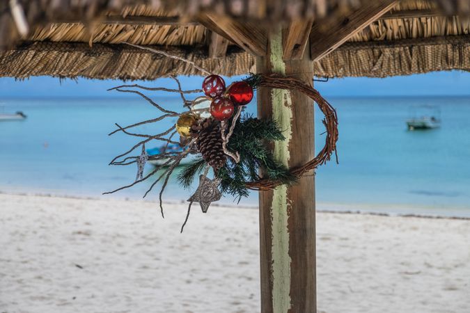 Minimal Christmas wreath hanging on the beach