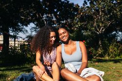 Girlfriends talking and enjoying in a park
