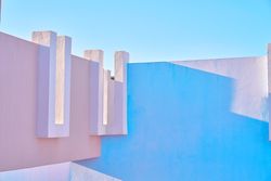 blue and pink wall construction against blue sea