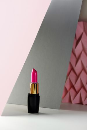 Lipstick on raised pink chevron. Product and make up concept