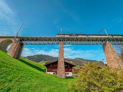 Train crossing over Gstaad viaduct, Switzerland