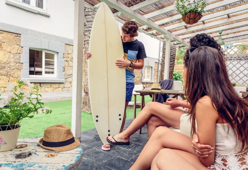 Group of people sitting around after surf class