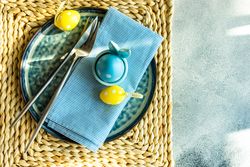 Pastel Easter holiday concept with dotted pastel Easter eggs decorating a table setting