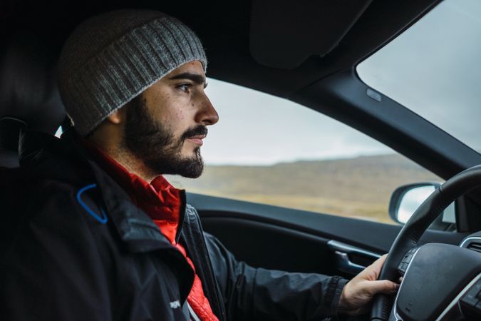 Man driving car in Faroe Islands