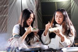 Two Female Friend Barbeque in front of Camping Tent