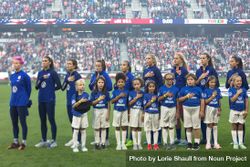 St. Paul, Minnesota, USA - Sept 3, 2019: USA Woman’s Soccer team and young players stand for anthem 4OKXZ4