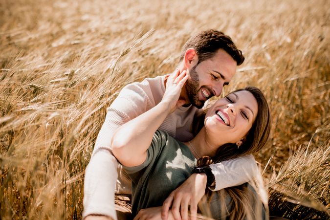 Serene lovers embracing on wheat field