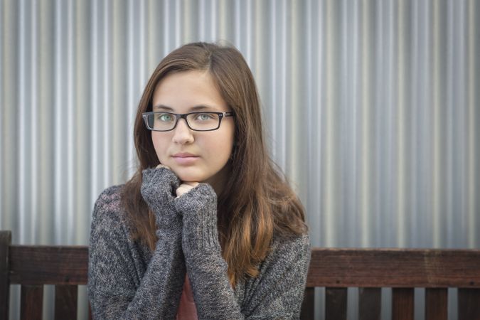 Portrait of Melancholy Young Girl with Glasses
