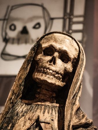 Depiction of death in ancient art. Skeleton statue.