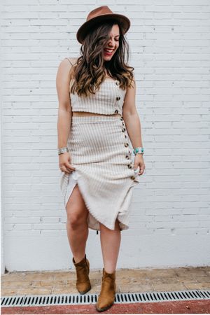 Woman smiling standing in white background