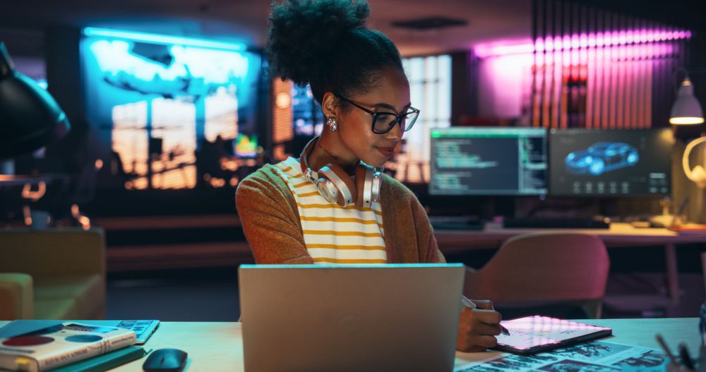 Black Female Specialist is Writing Business Strategy, Using Digital Tablet to Take Notes in Creative Office Environment.