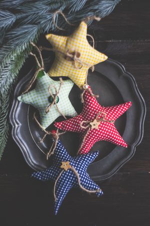 Handmade decorations of stars on dark wooden table