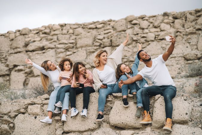 Big multiethnic family travelling together on nature