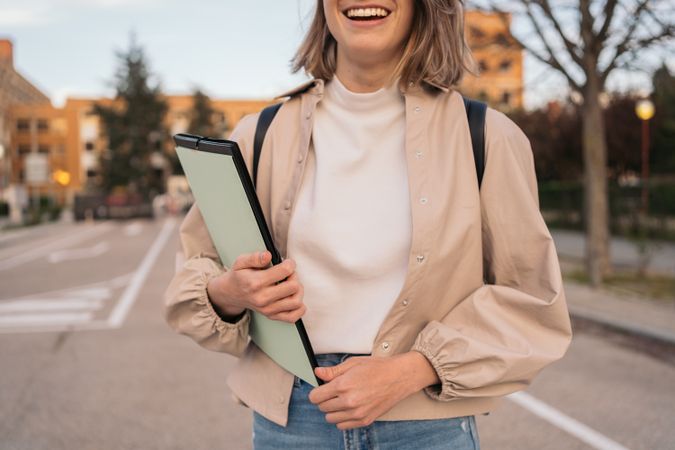 half-portrait of a smiling female student