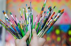 Person holding paint brush