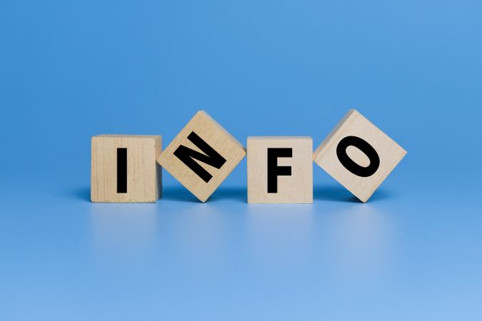 info word text on wooden blocks isolated on blue background