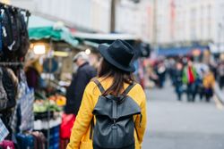 Unrecognizable tourist walking on street during festival