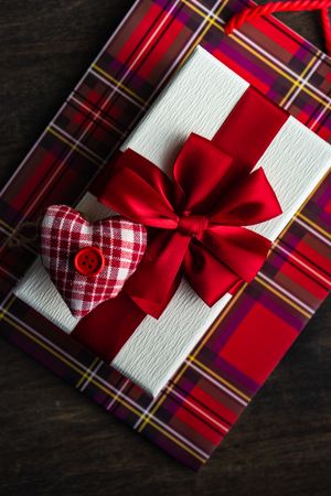 Tartan wrapped gifts with ribbon and heart ornament
