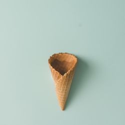 Waffle cone on pastel blue background
