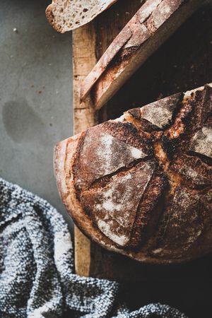 Freshly baked sourdough bread loaf, slices close up