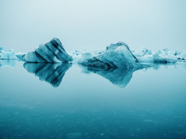 Ice on water between snow