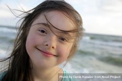 Close up of young girl at the beach 4ApwR5