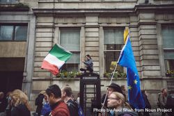 London, England, United Kingdom - March 23rd, 2019: Woman stop phone box with Italian flag 4OdJab