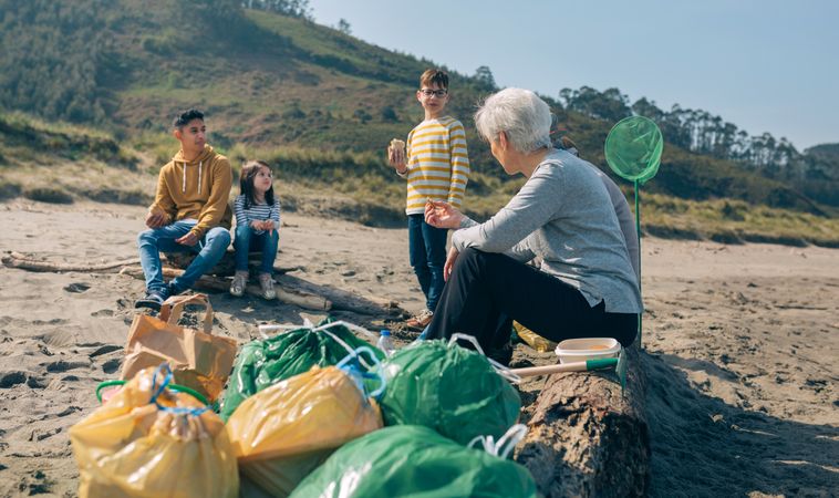 Volunteers resting after cleaning the beach