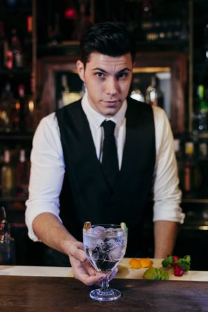 Barman working making drinks