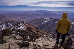 Hiker enjoying majestic view at mountain top